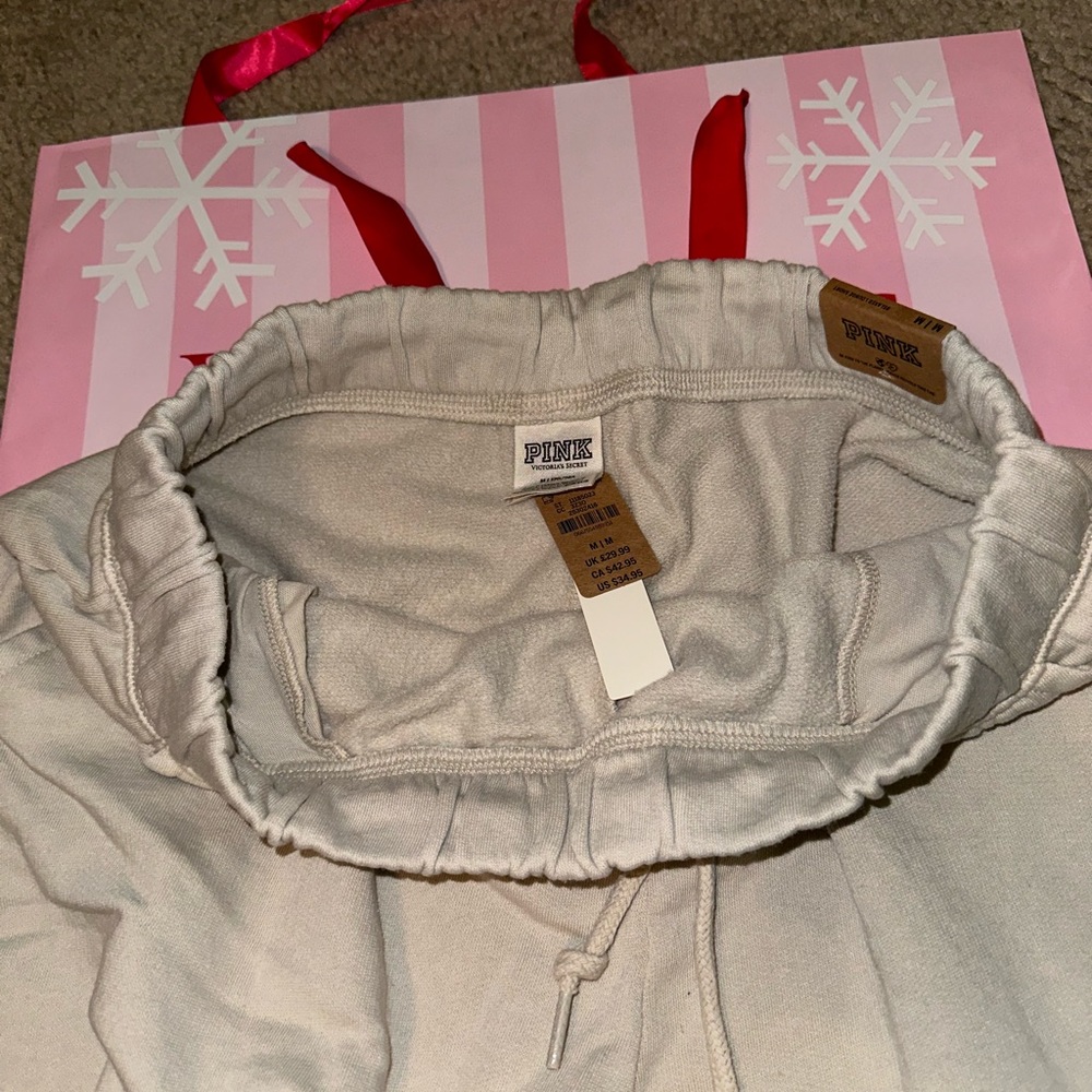 Pink logo dad shorts black and tan are new with tags. Gray is used. - Picture 6 of 10